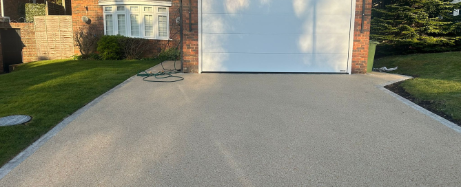 After: New Resin bound driveway with new turf lawn by Crown Paving