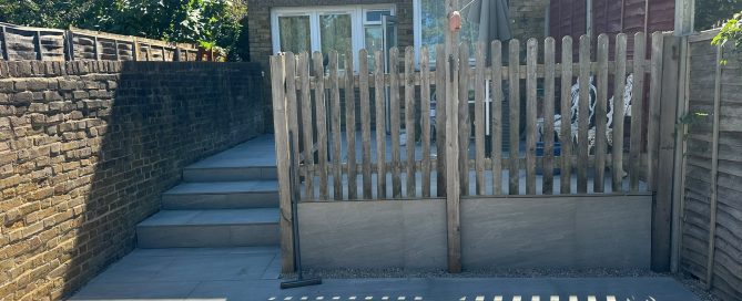Completed porcelain tiled steps and patio forming a smart transition between the upper and lower garden levels.