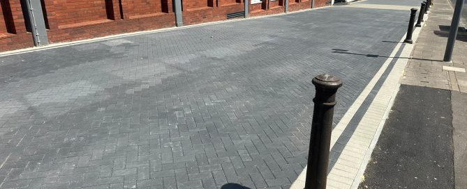Finished dark grey block paving with light edging beside Registry Heights in Beckenham.