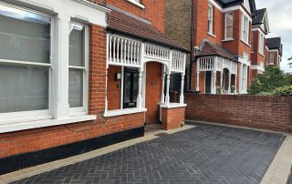 Completed block paved driveway outside a residential red-brick property in Eltham.