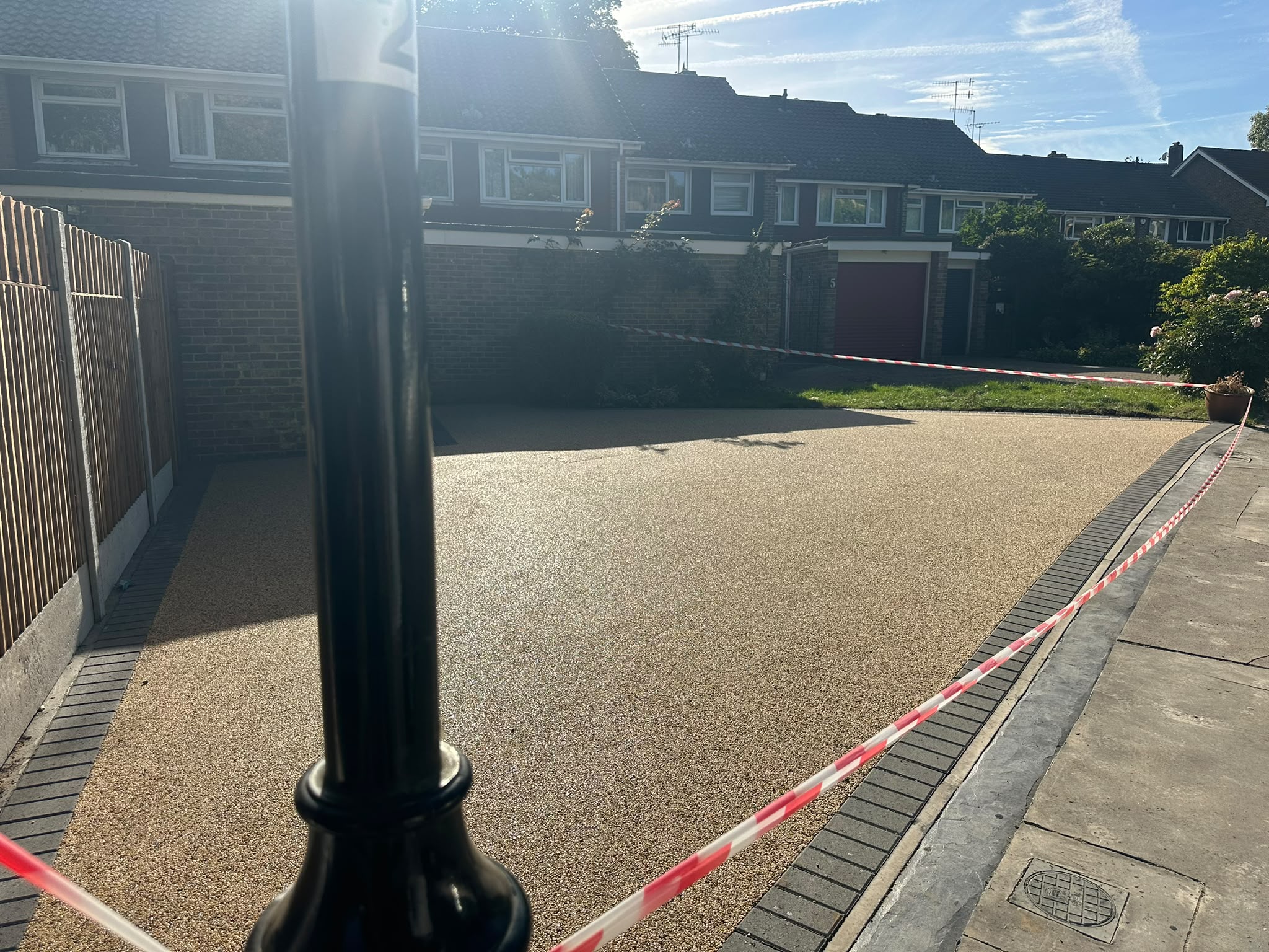 Completed resin bound driveway with dark block edging at a residential property in Selsdon