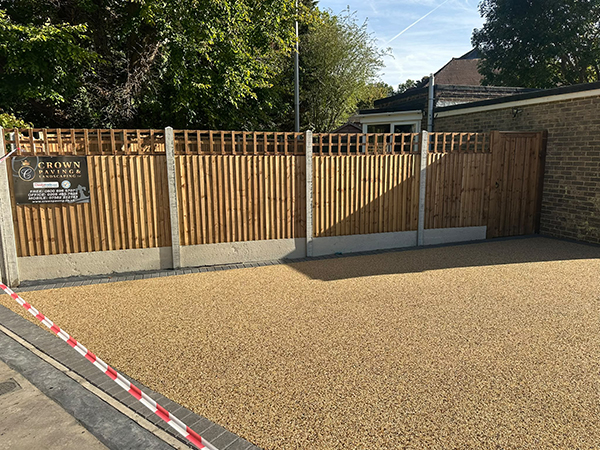 Resin bound driveway beside newly installed timber fencing and garden gate in Selsdon